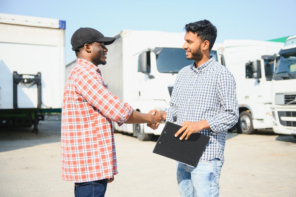 Logistics manager controlling truck driver schedule